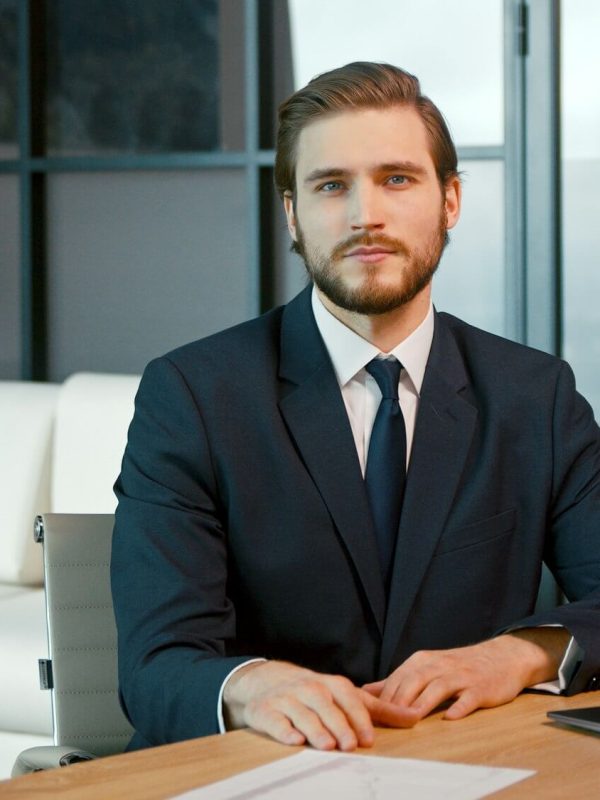young-man-looking-at-camera-consult-client.jpg